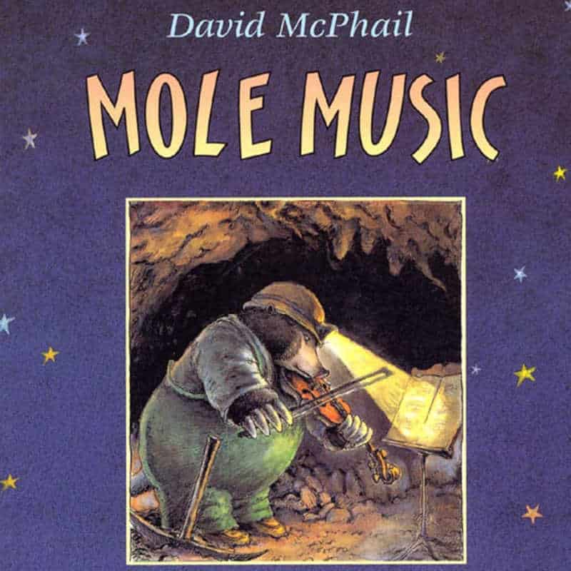 Cover of David McPhail’s book “Mole Music” showing a mole playing a violin in a cave.