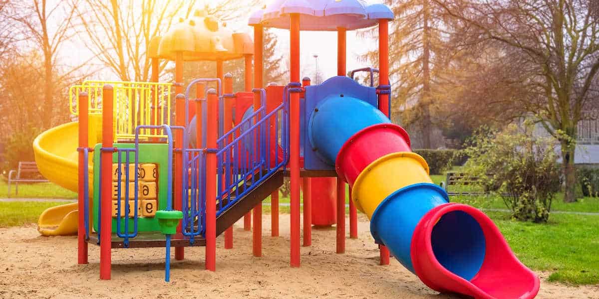 Playgrounds in Western Massachusetts: Colorful playground structure with slides and climbing equipment in a park in Western Massachusetts, perfect for family fun and community play.